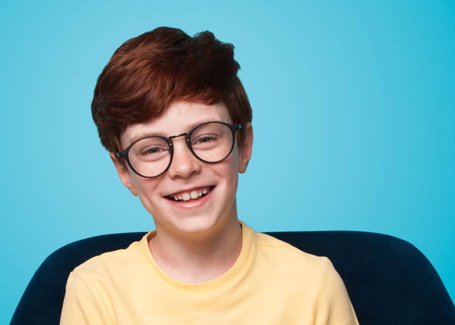 Ginger Boy Sitting Armchair Wearing Eyeglasses